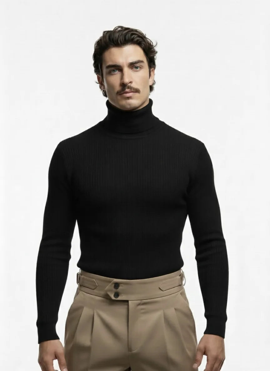Man wearing a black turtleneck and beige pants on a white background