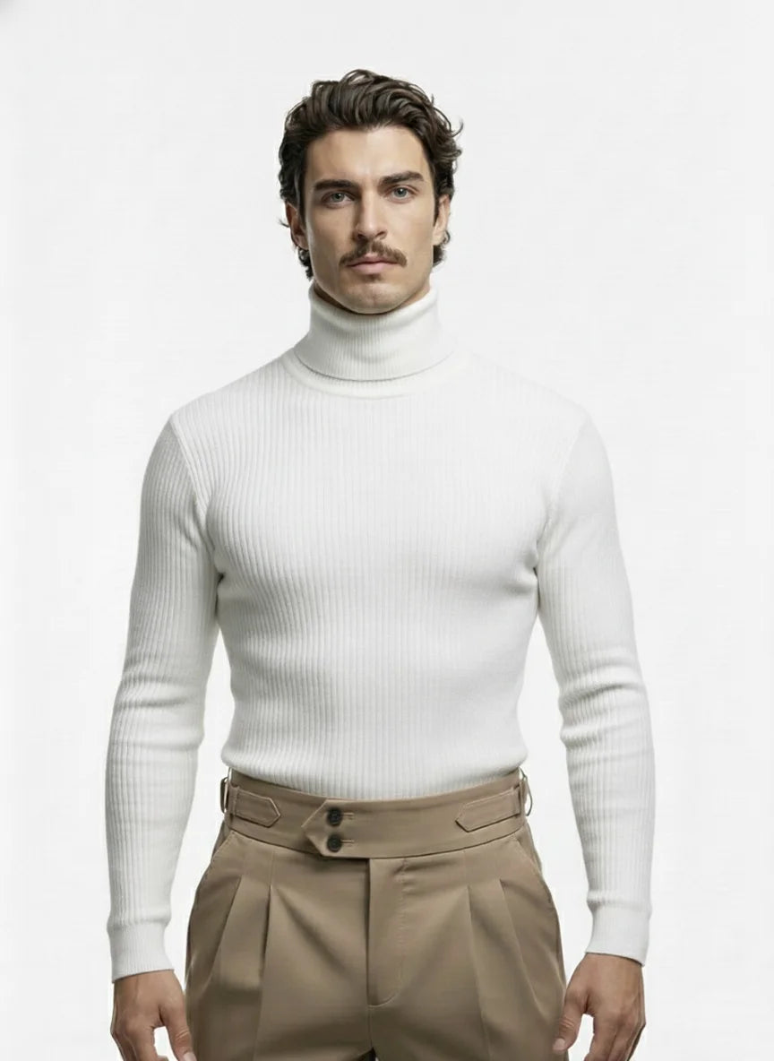 Man wearing a white turtleneck sweater and beige pants on a white background