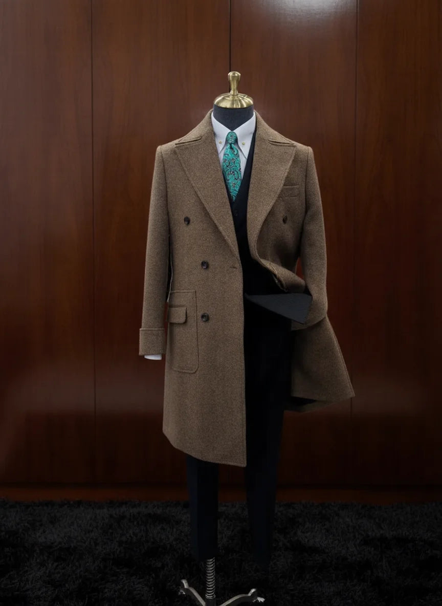 Brown coat on a mannequin against a wooden panel background